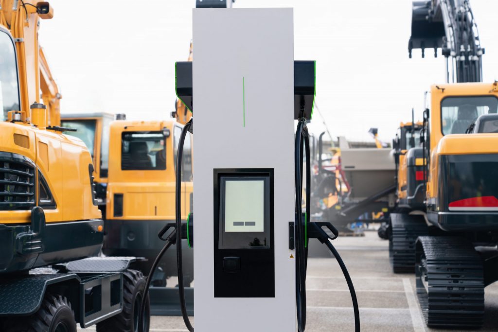 Electric construction machines with charging station. Concept.