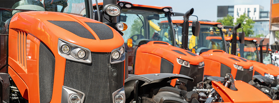 Row of agricultural tractors for sale